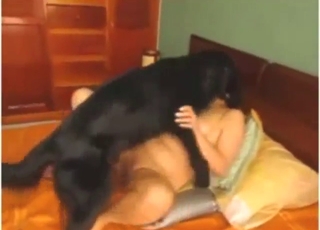 Big-breasted older gal gets fucked by a black dog