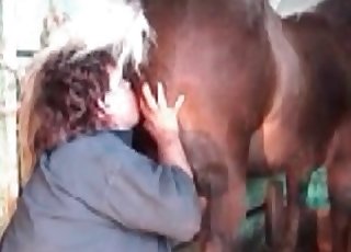 Filthy woman giving a rim job to a handsome horse
